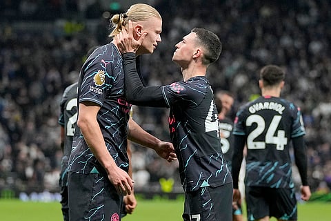Erling Haaland and Phil Foden celebrate their side's second goal